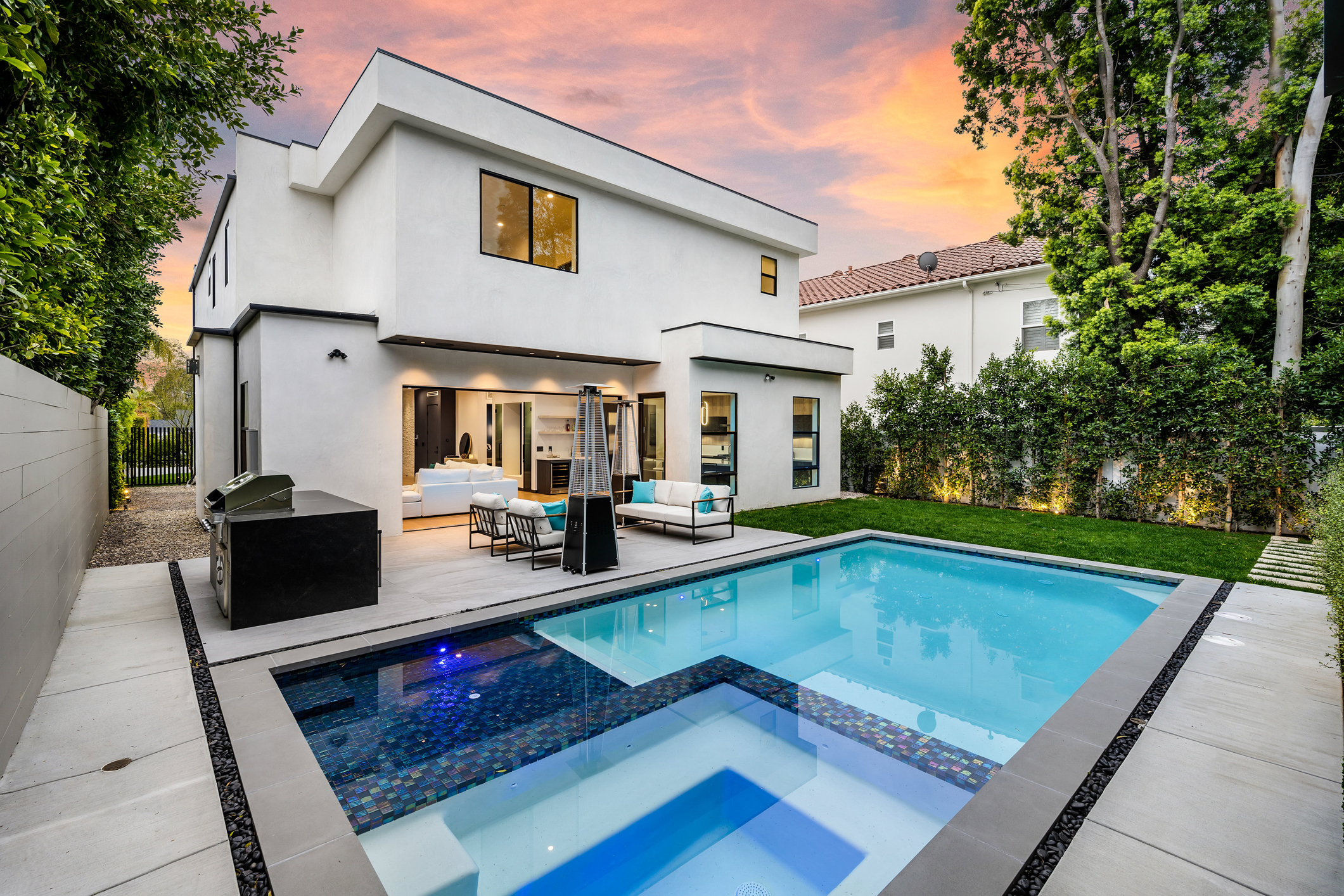 Evening landscape lighting with paver patio Rayne