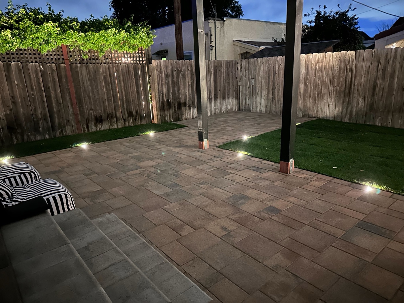 Outdoor kitchen with bar seating in Carencro by Abshire Brothers Lawn & Landscape