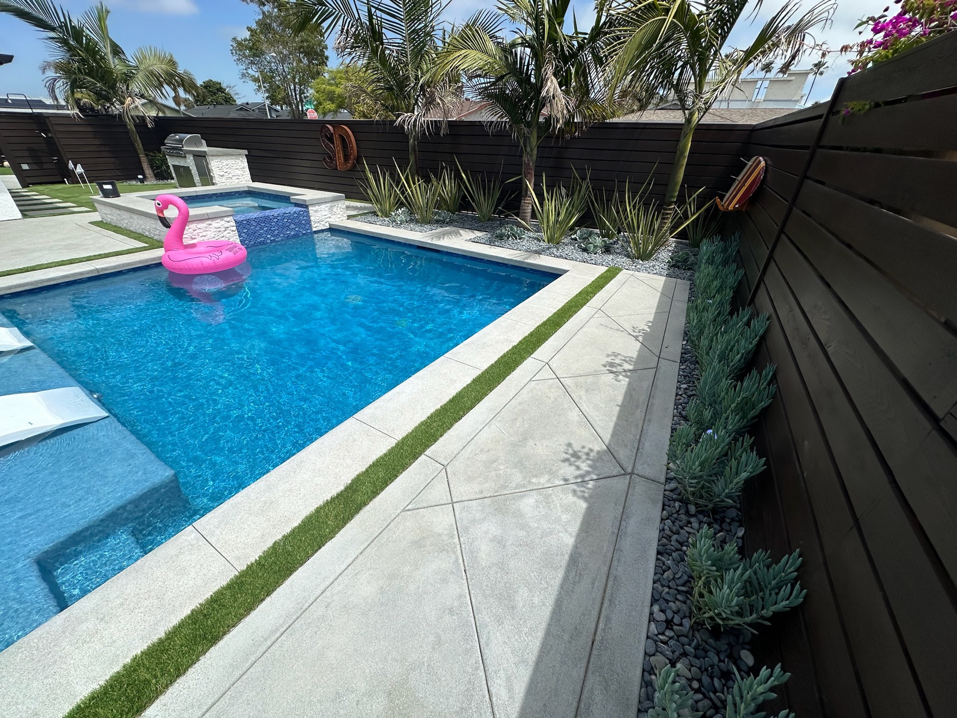 Resort-style pool and spa, designed and built by Abshire Brothers Lawn & Landscape in Abbeville, Acadiana