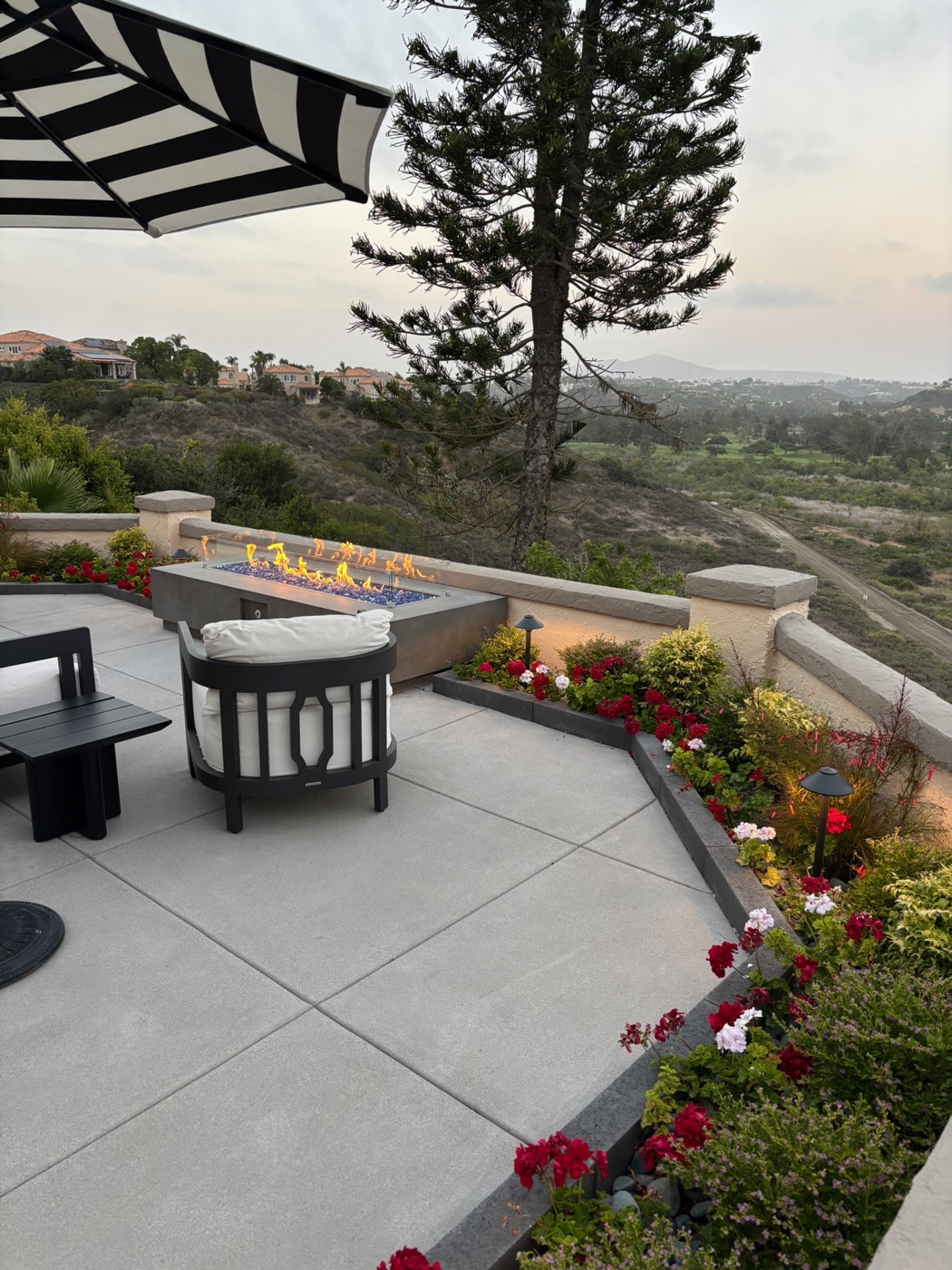 Hilltop fire table and view terrace in Eunice by Abshire Brothers Lawn & Landscape