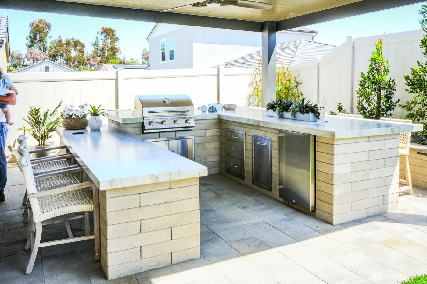 Covered outdoor kitchen and bar in Eunice by Abshire Brothers Lawn & Landscape