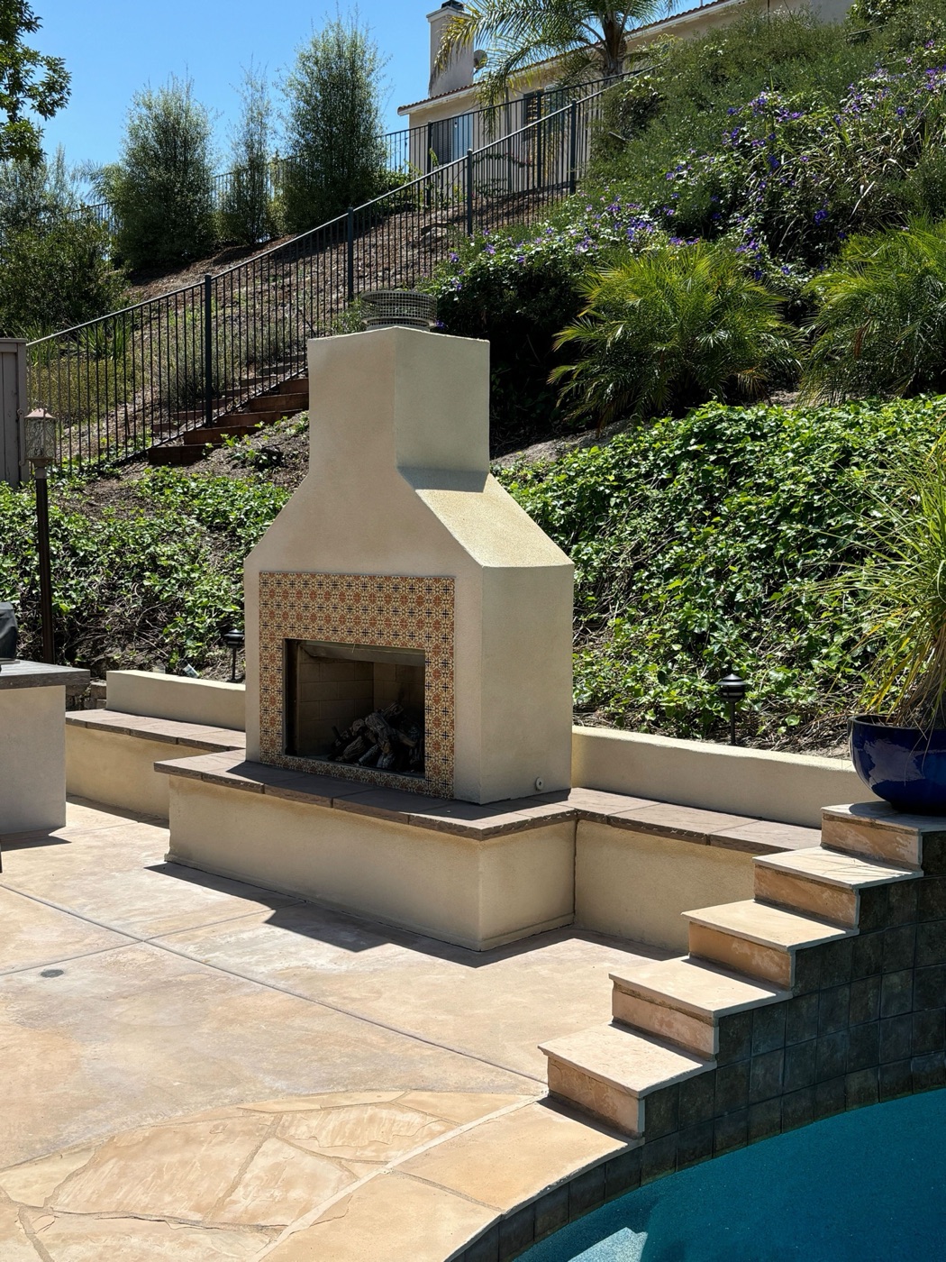 Pool with a raised spa by Abshire Brothers Lawn & Landscape in Iota