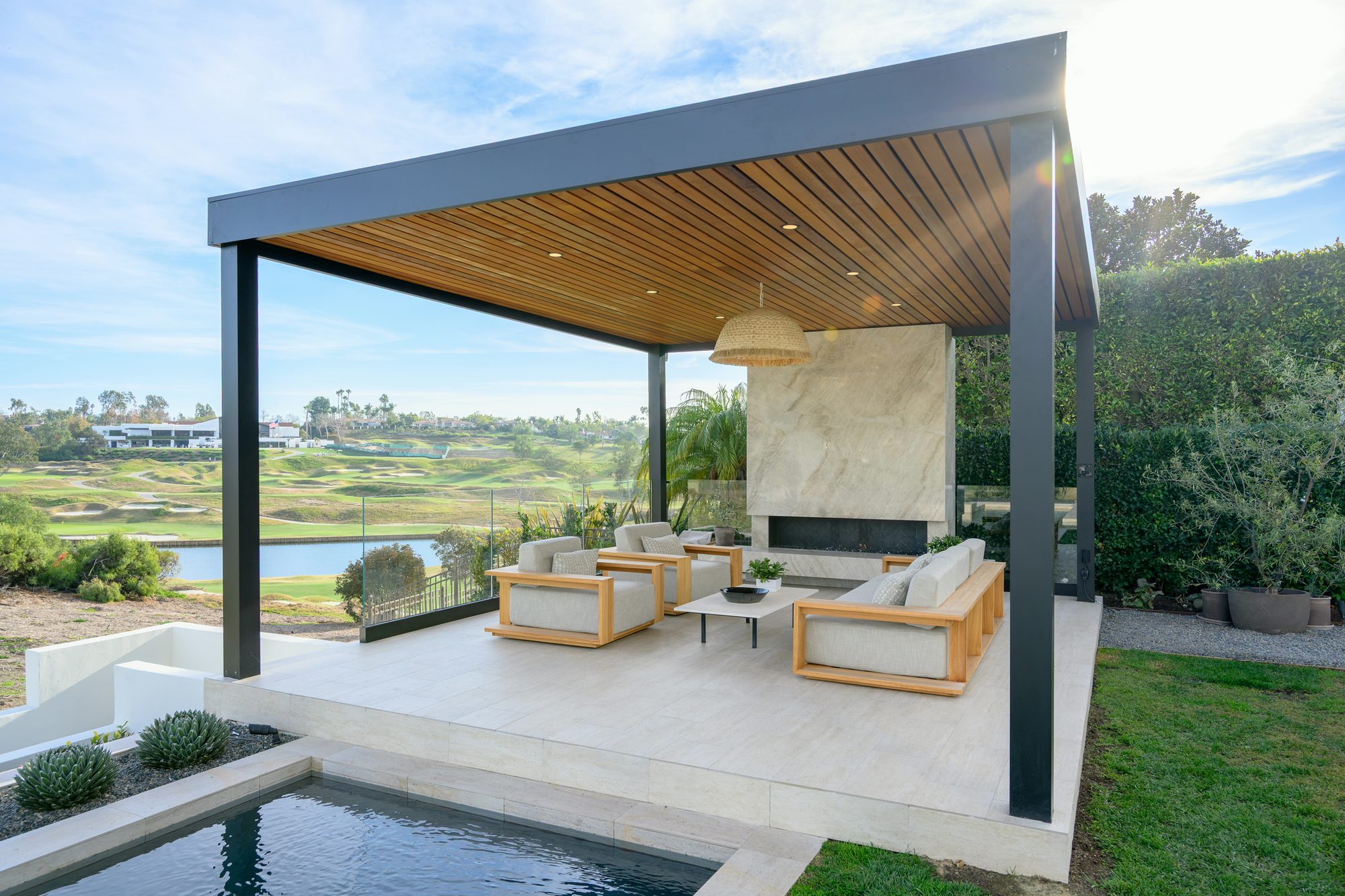 Aluminium patio cover built as an outdoor room over the former pool-equipment area