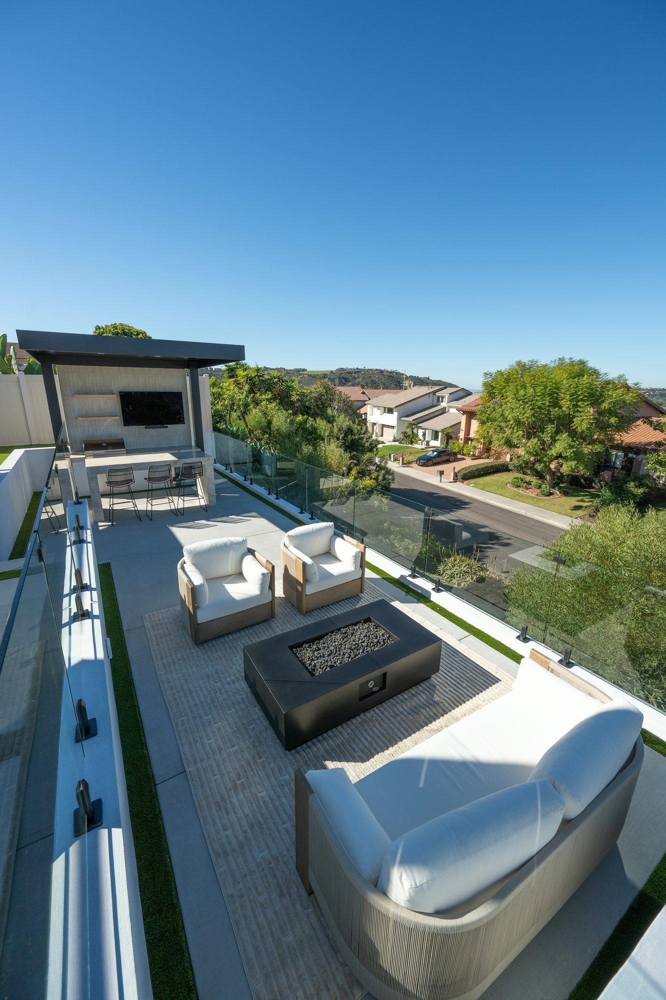 Fire-pit lounge with facing sofas overlooking the Lafayette hillside