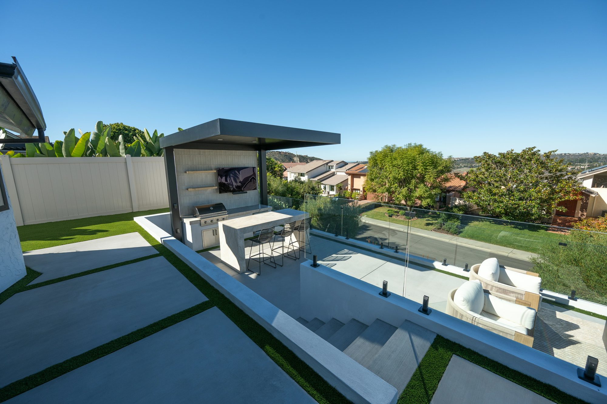 Multiple entertaining levels stepped down the yard on custom CMU retaining walls